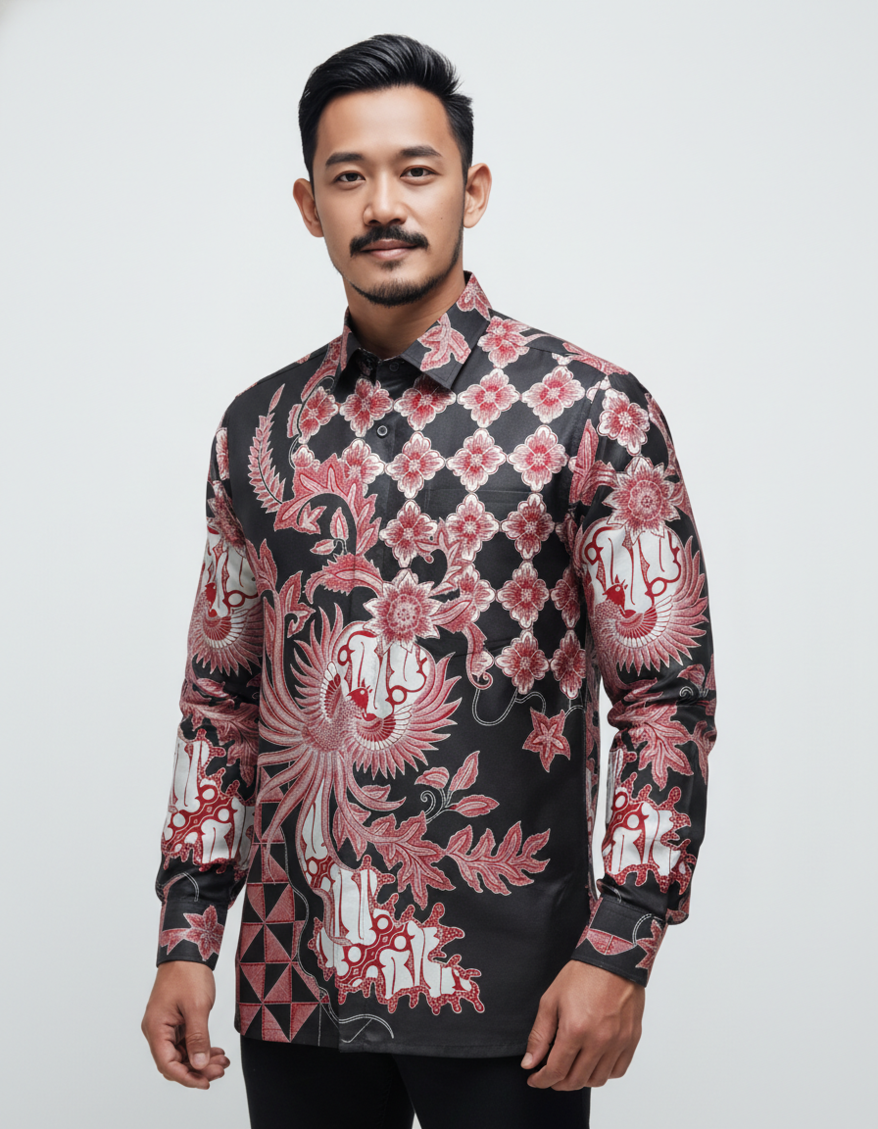 Kemeja batik tulis lengan panjang motif Garuda Api merah menyala di atas kain katun primissima hitam.
